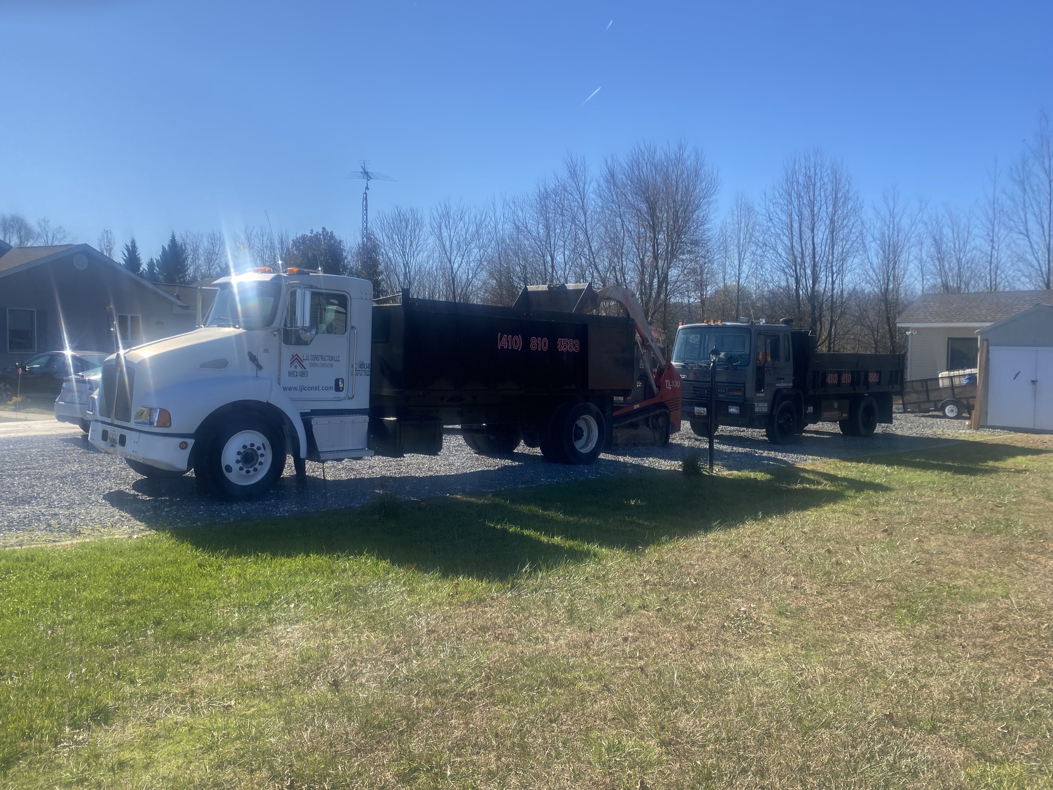 A 5 ton truck with trailer ready to work.